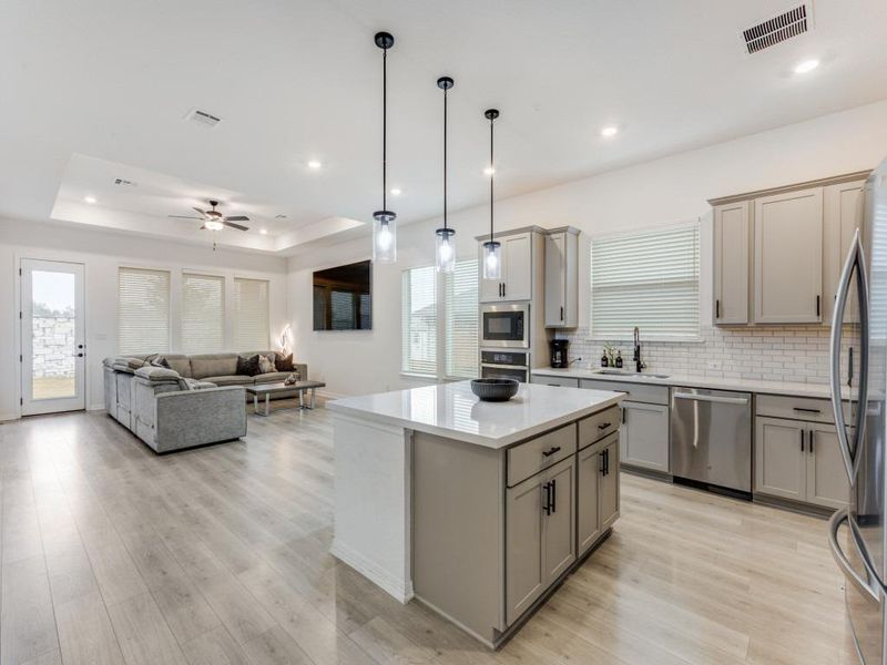 An open-concept keeps the kitchen, dining and living room all connected.