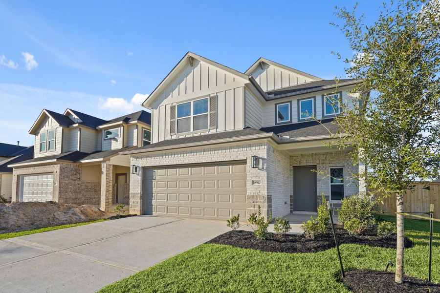 Front exterior of a new home in Grand Oaks Village, Houston, TX, highlighting curb appeal (Image 16). Front exterior of a new home in Grand Oaks Village, Houston, TX, highlighting curb appeal (Image 16).