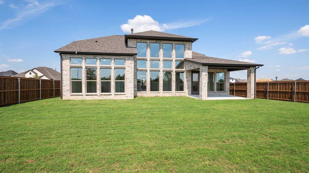 Front exterior of a new home in Trinity Falls 60', McKinney, TX, highlighting curb appeal (Image 2). Front exterior of a new home in Trinity Falls 60', McKinney, TX, highlighting curb appeal (Image 2).