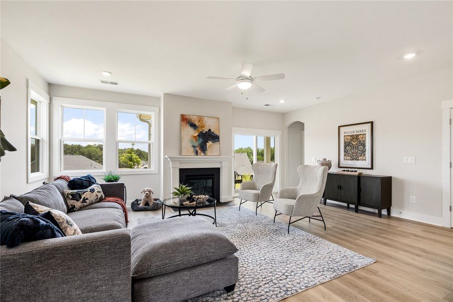 A fireplace and ceiling fan anchor this inviting l A fireplace and ceiling fan anchor this inviting l