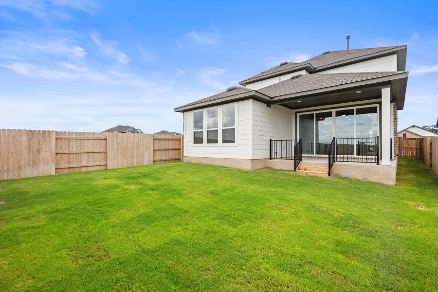 Exterior details and patio area of a home in Lariat, Liberty Hill (Image 26).