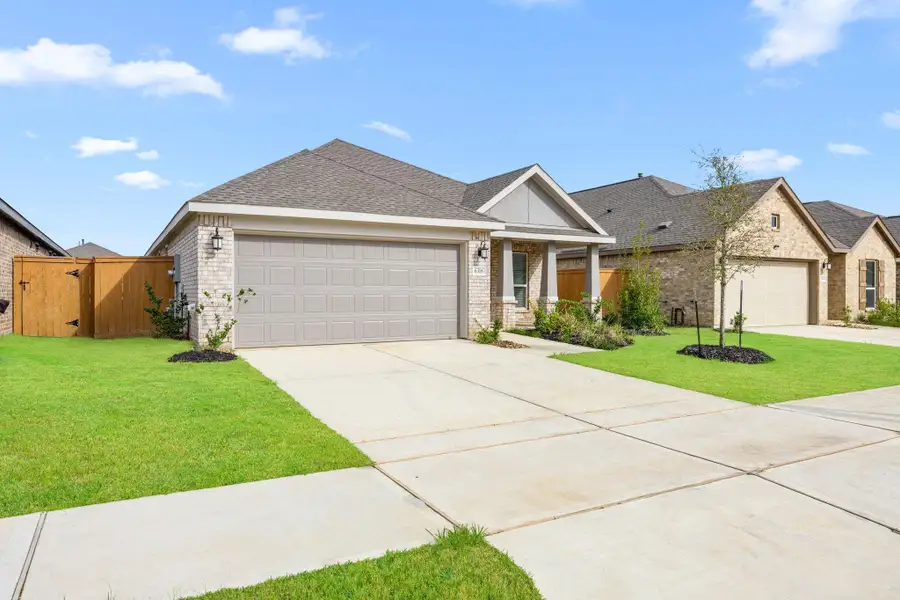 Front exterior of a new home in Sunterra, Katy, TX, highlighting curb appeal (Image 1). Front exterior of a new home in Sunterra, Katy, TX, highlighting curb appeal (Image 1).