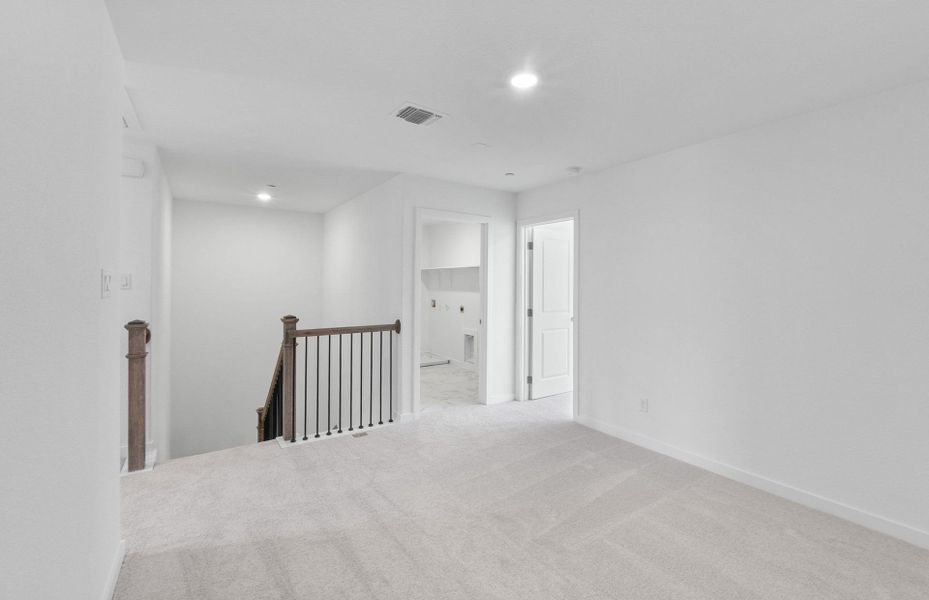 Representative unfurnished interior of a home built from the Easton by Pulte Homes in Monarch on Main, Round Rock (Image 12). Representative unfurnished interior of a home built from the Easton by Pulte Homes in Monarch on Main, Round Rock (Image 12).