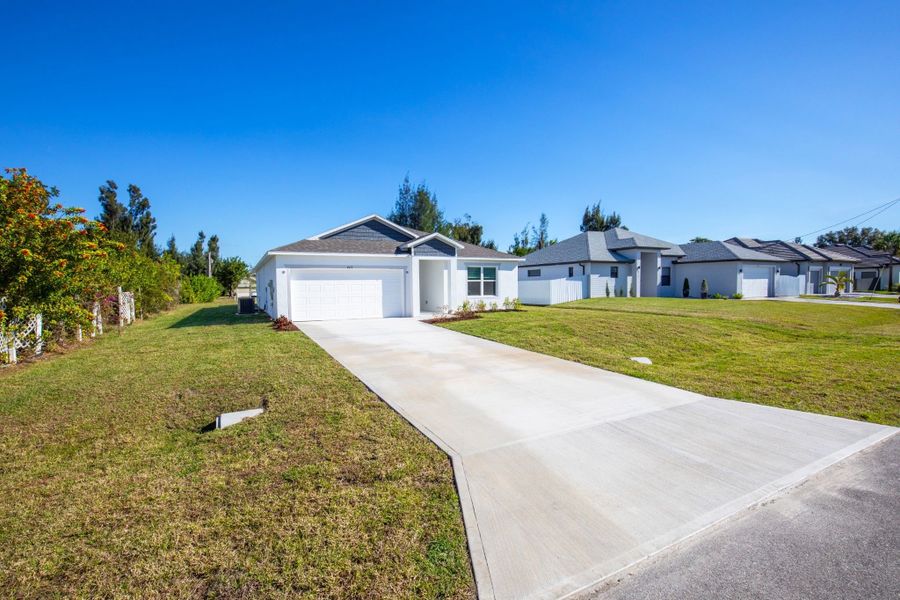 Front exterior of a new home in Cape Coral, Cape Coral, FL, highlighting curb appeal (Image 20).