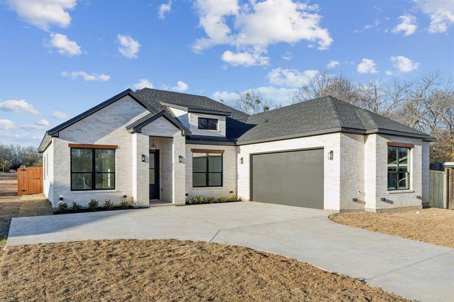 Front exterior of a new home in , Lancaster, TX, highlighting curb appeal (Image 1). Front exterior of a new home in , Lancaster, TX, highlighting curb appeal (Image 1).
