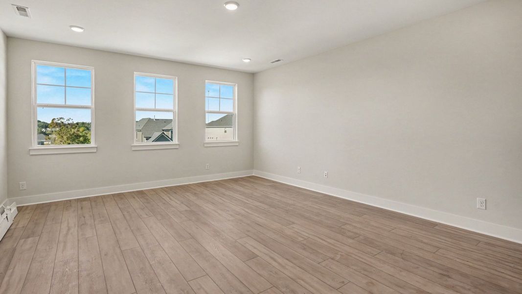 Natural light spills in this secondary bedroom with the Solace II home plan Natural light spills in this secondary bedroom with the Solace II home plan