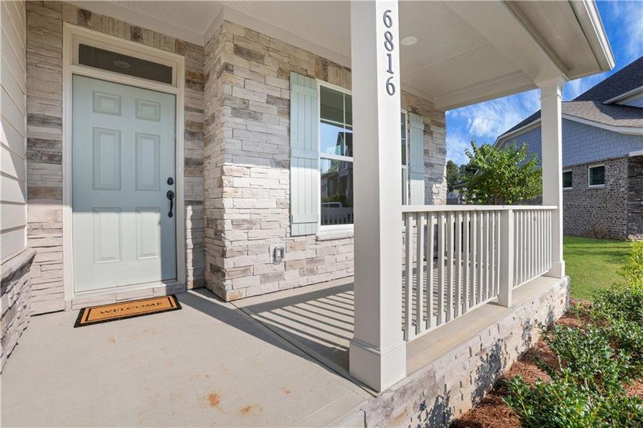 Front exterior of a new home in Cambridge, Flowery Branch, GA, highlighting curb appeal (Image 19). Front exterior of a new home in Cambridge, Flowery Branch, GA, highlighting curb appeal (Image 19).