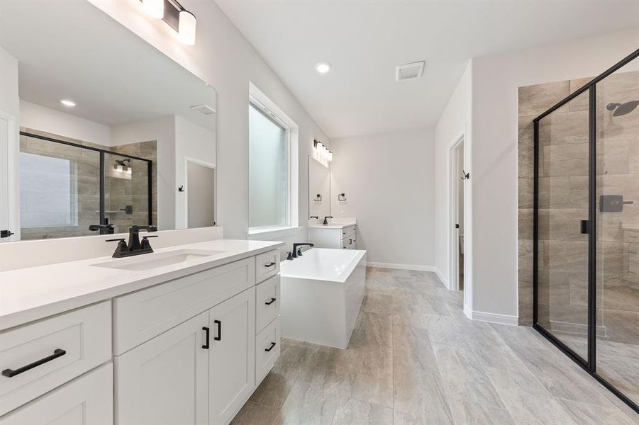 With his and her vanities and ample space for two, you'll love calling this dream bath your own! With his and her vanities and ample space for two, you'll love calling this dream bath your own!