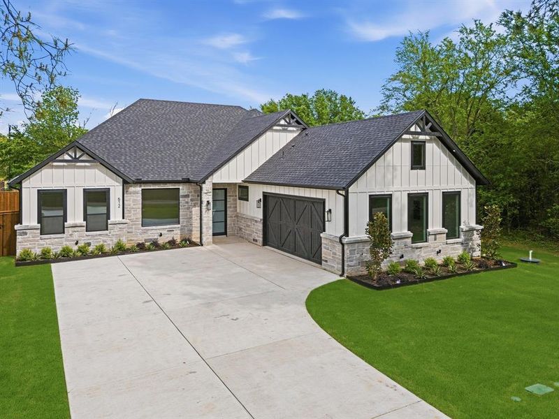 Front exterior of a new home in , Tool, TX, highlighting curb appeal (Image 1). Front exterior of a new home in , Tool, TX, highlighting curb appeal (Image 1).