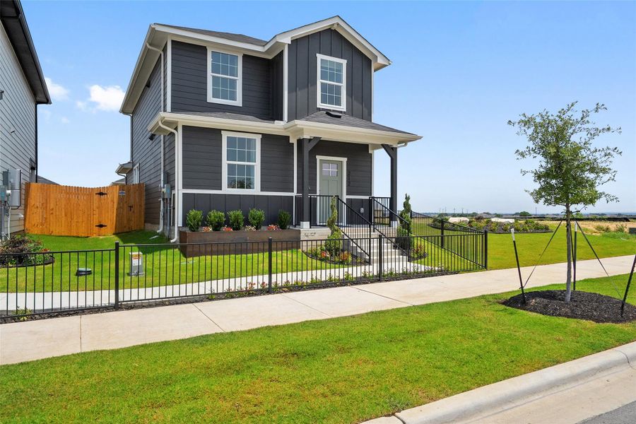 Front exterior of a new home in Valverde, Bastrop, TX, highlighting curb appeal (Image 23). Front exterior of a new home in Valverde, Bastrop, TX, highlighting curb appeal (Image 23).