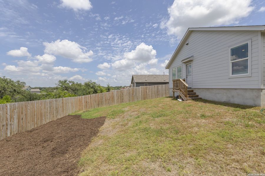 Exterior details and patio area of a home in Brookmill, San Antonio (Image 24).