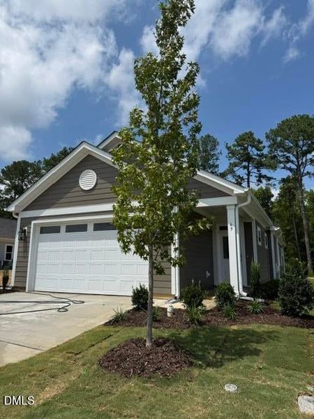 Front exterior of a new home in The Walk at East Village, Clayton, NC, highlighting curb appeal (Image 2).