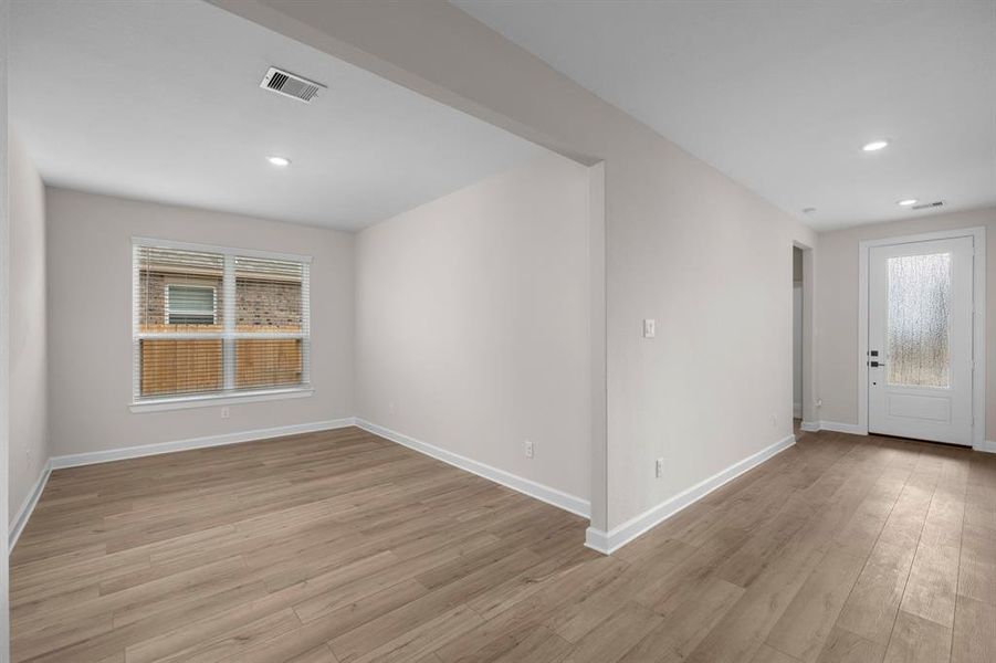 Elegant formal dining room located just off the living room, offering a seamless flow for entertaining. This space features ample natural light and provides the perfect setting for family gatherings and dinner parties