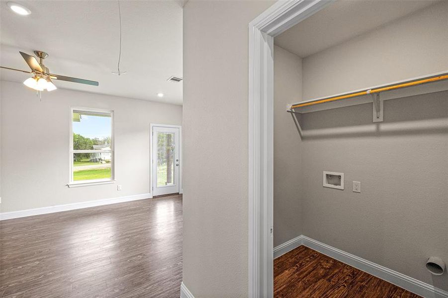 Washroom with hookup for a washing machine, ceiling fan, and dark hardwood / wood-style flooring