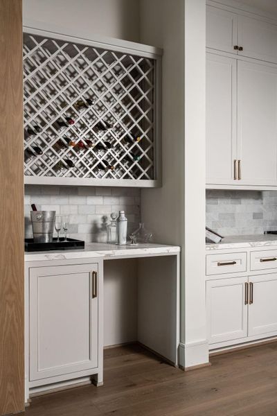 Between the dining room and the kitchen is a butler's pantry with a spot for the to-be-installed beverage cooler. Between the dining room and the kitchen is a butler's pantry with a spot for the to-be-installed beverage cooler.