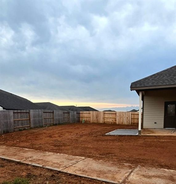 Front exterior of a new home in Sunterra, Katy, TX, highlighting curb appeal (Image 13).