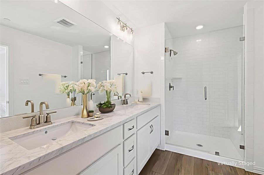 Primary Bathroom with double vanity, a stall shower, and recessed lighting Primary Bathroom with double vanity, a stall shower, and recessed lighting