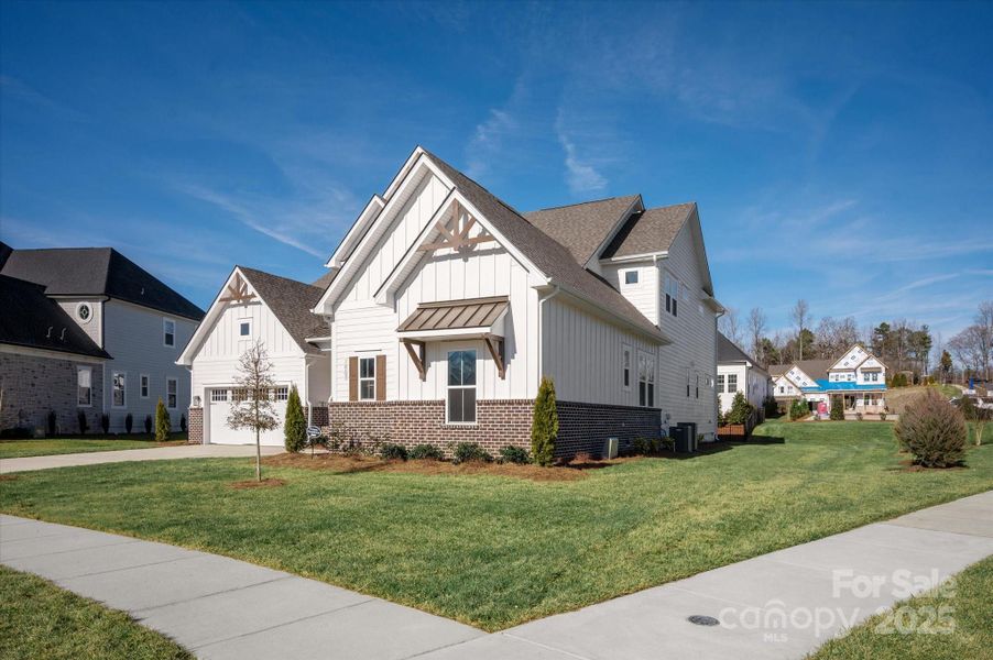 Front exterior of a new home in Heritage at Marvin, Marvin, NC, highlighting curb appeal (Image 2). Front exterior of a new home in Heritage at Marvin, Marvin, NC, highlighting curb appeal (Image 2).