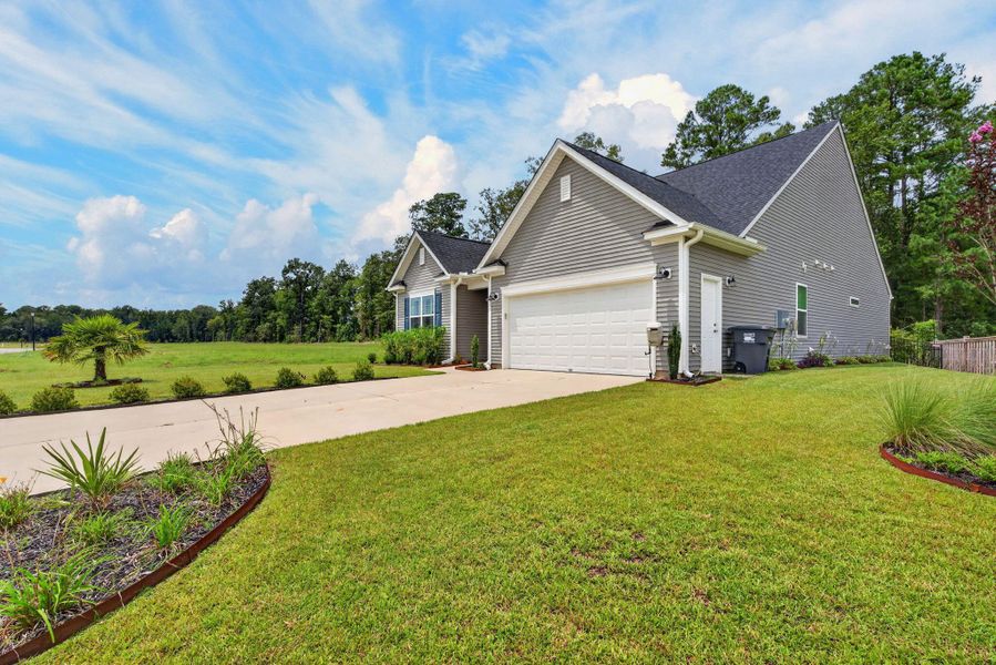 Front exterior of a new home in , Ridgeville, SC, highlighting curb appeal (Image 22).