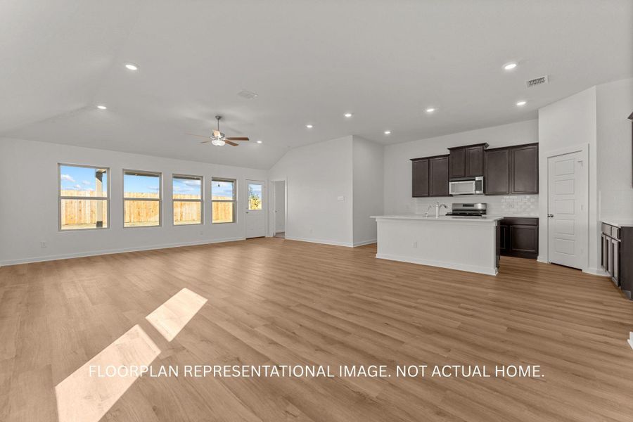 An open-concept great room and kitchen flow seamlessly, offering an inviting space for daily living.