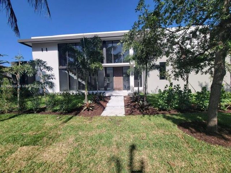 Front exterior of a new home in , South Miami, FL, highlighting curb appeal (Image 1). Front exterior of a new home in , South Miami, FL, highlighting curb appeal (Image 1).