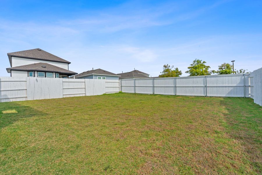 Front exterior of a new home in Harvest Ridge, Elgin, TX, highlighting curb appeal (Image 20).