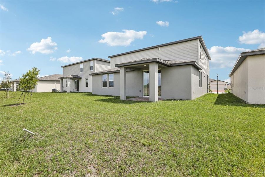 Exterior details and patio area of a home in The Meadow at Crossprairie, St. Cloud (Image 29).