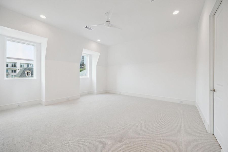 The third floor features this expansive bedroom with oversized walk-in closet and en-suite bathroom. The third floor features this expansive bedroom with oversized walk-in closet and en-suite bathroom.