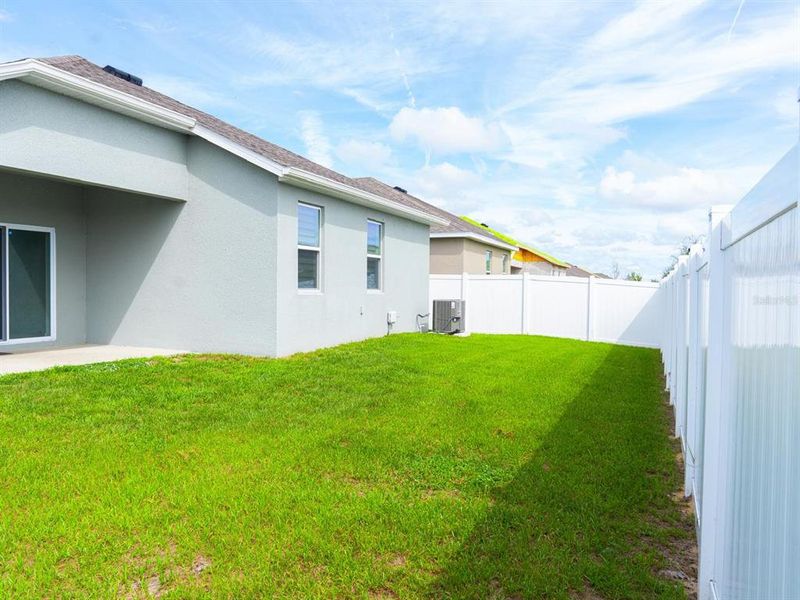 Exterior details and patio area of a home in Cypress Park Estates, Haines City (Image 18).