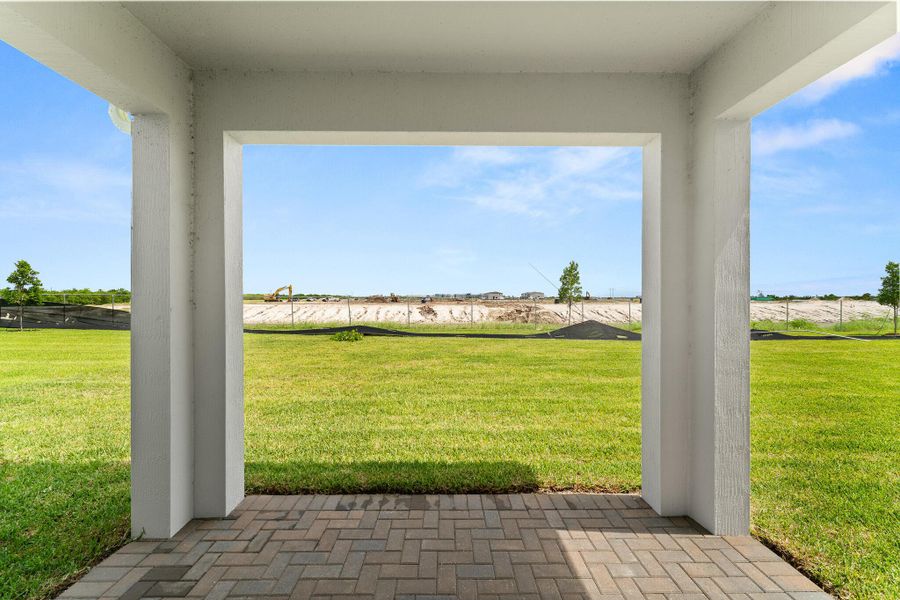 Exterior details and patio area of a home in Tradition - Cadence, Port St. Lucie (Image 1).