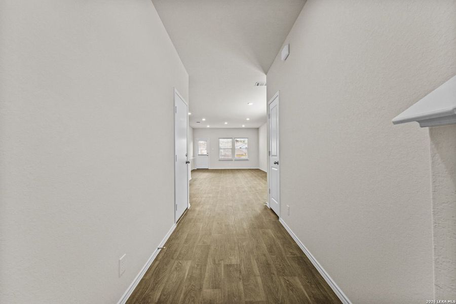 Spacious, unfurnished interior of a new home in Hunters Ranch, San Antonio (Image 13).