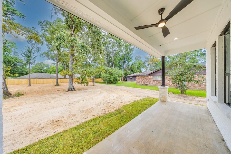 Covered patio deck perfect for outdoor relaxation and entertaining, providing shade and a comfortable space to enjoy the backyard. Covered patio deck perfect for outdoor relaxation and entertaining, providing shade and a comfortable space to enjoy the backyard.