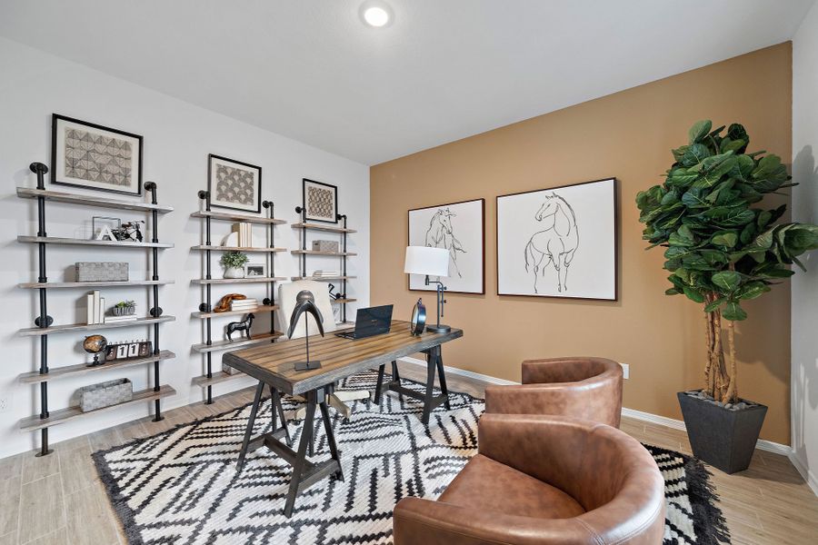 A living room with a table and chairs. A living room with a table and chairs.