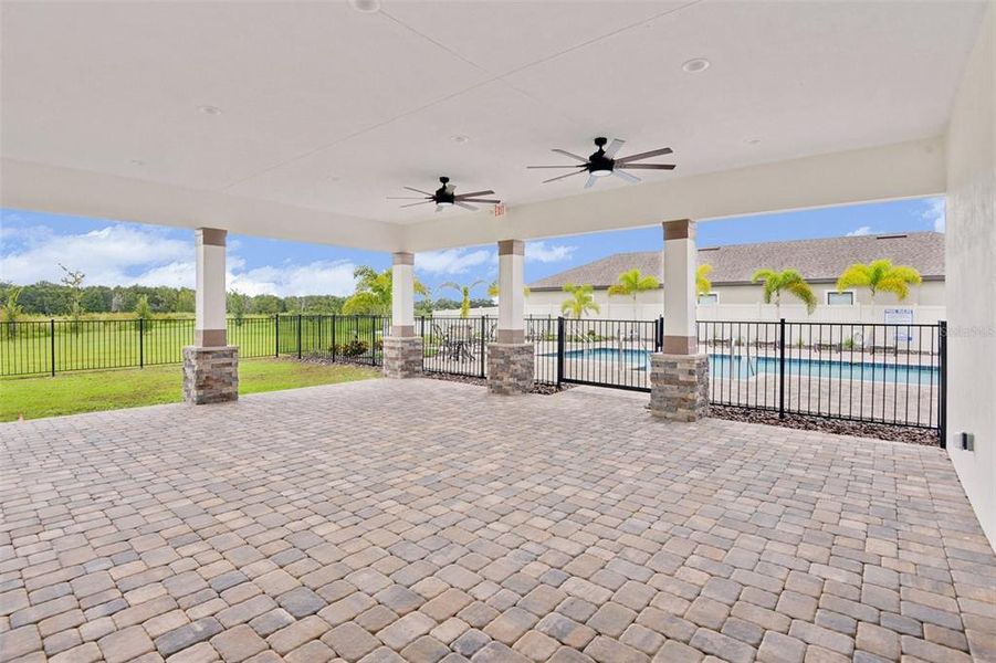 Exterior details and patio area of a home in Grasslands West, Lakeland (Image 4).