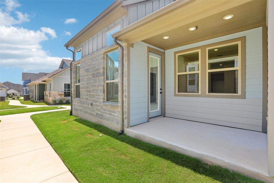 Front exterior of a new home in Villas at Kissing Tree, San Marcos, TX, highlighting curb appeal (Image 1).