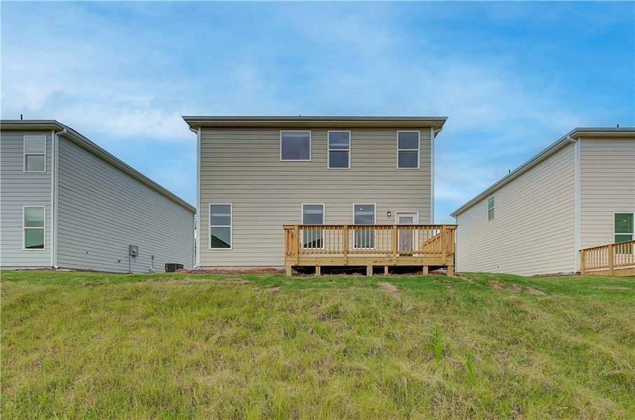 Front exterior of a new home in Enclave at Evergreen, Fairburn, GA, highlighting curb appeal (Image 13). Front exterior of a new home in Enclave at Evergreen, Fairburn, GA, highlighting curb appeal (Image 13).