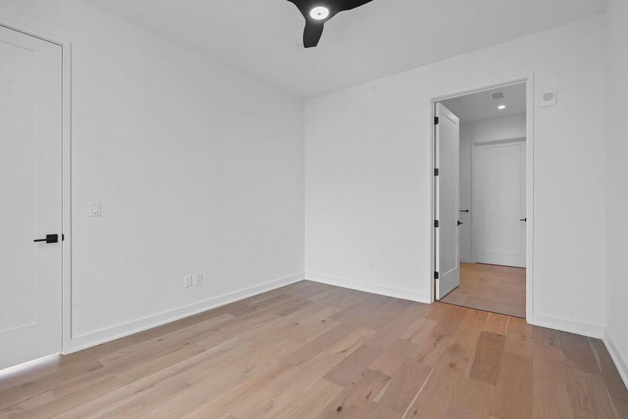 Spare room with light wood-style floors and baseboards