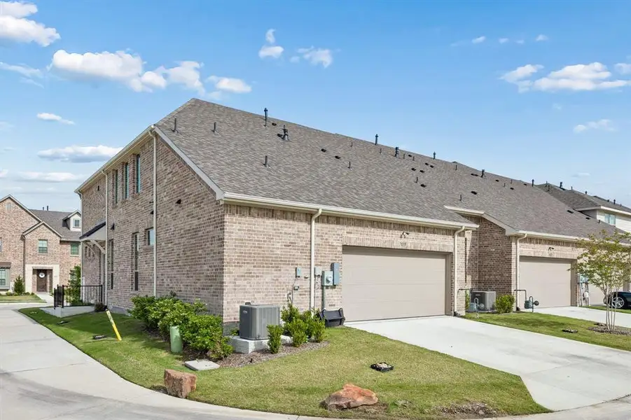 Front exterior of a new home in , Grand Prairie, TX, highlighting curb appeal (Image 20).