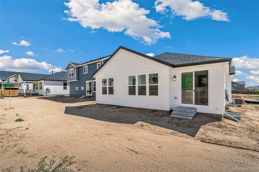 Front exterior of a new home in Turnberry, Commerce City, CO, highlighting curb appeal (Image 18).