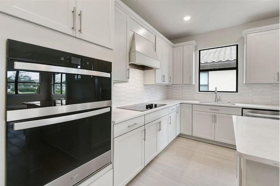 Furnished interior view inside a new home in Preserve at Waterway Village, Vero Beach (Image 32).