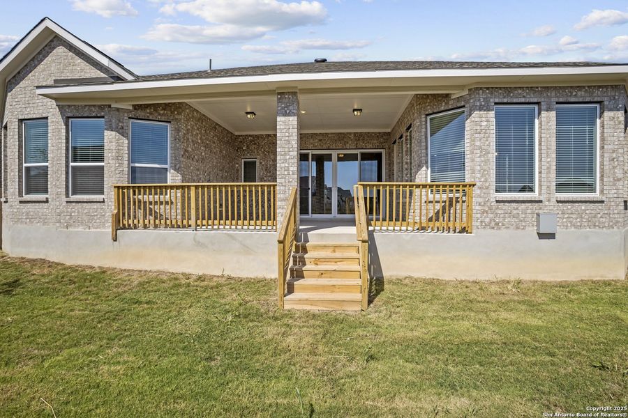 Exterior details and patio area of a home in Stillwater Ranch 45', San Antonio (Image 17).