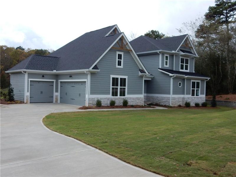 Front exterior of a new home in , Demorest, GA, highlighting curb appeal (Image 1).