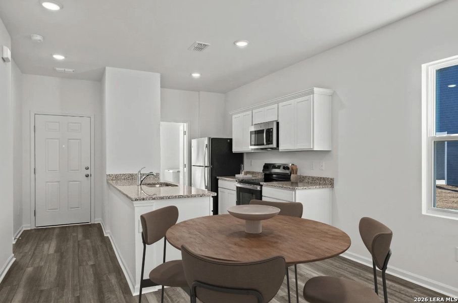 Furnished interior view inside a new home in Sutton Farms, San Antonio (Image 6).