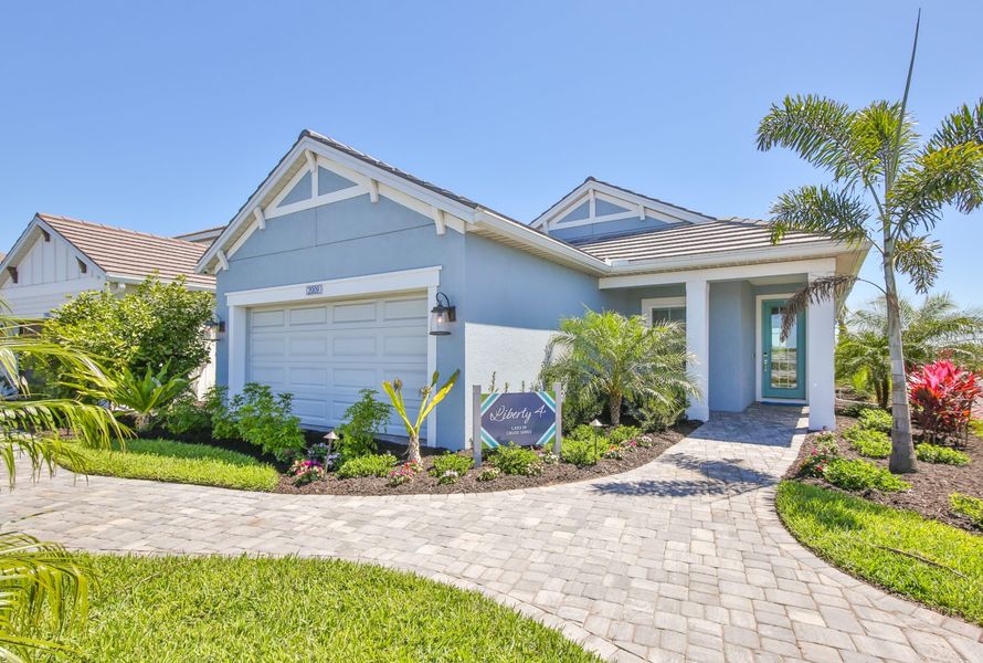 Representative exterior photo of a completed home built from the Liberty 4 by Neal Communities in Palm Grove, Bradenton, FL (Image 24). Representative exterior photo of a completed home built from the Liberty 4 by Neal Communities in Palm Grove, Bradenton, FL (Image 24).