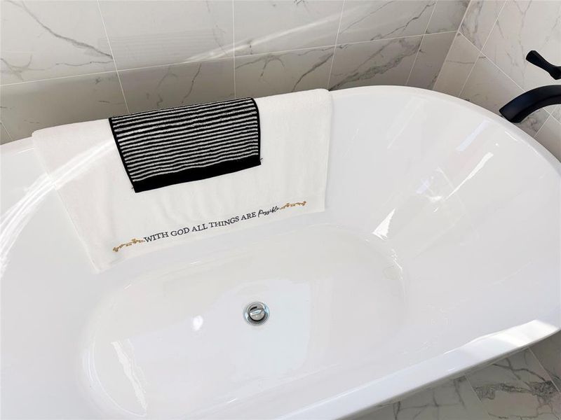 Bathroom view of a tub and a sink