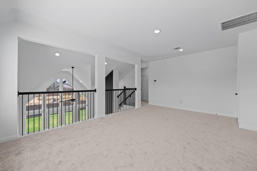 This huge game room overlooks the family room and is perfect for game night, entertaining or just relaxing. This huge game room overlooks the family room and is perfect for game night, entertaining or just relaxing.