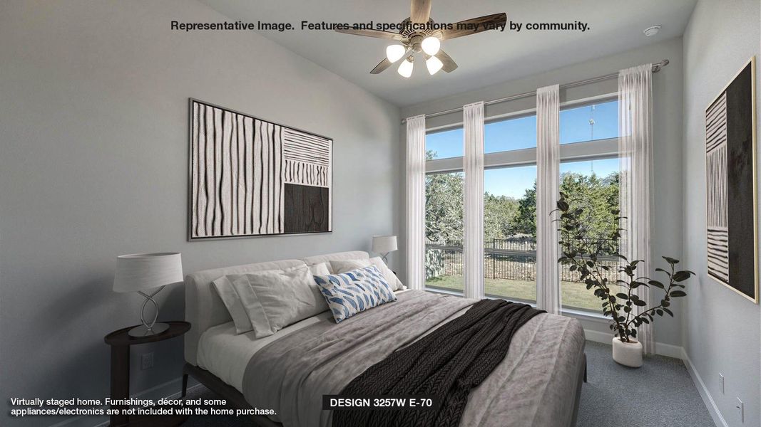Carpeted bedroom featuring baseboards and a ceiling fan Carpeted bedroom featuring baseboards and a ceiling fan