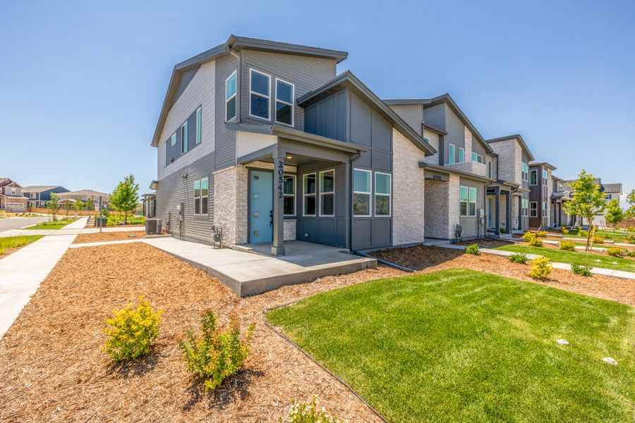 Front exterior of a new home in Painted Prairie, Aurora, CO, highlighting curb appeal (Image 20).