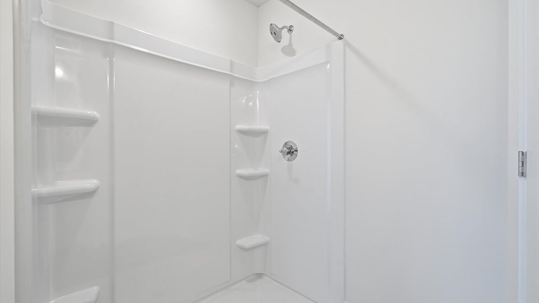 Superior en-suite primary bathroom with a stylish walk-in shower—crafted with high standards in mind Superior en-suite primary bathroom with a stylish walk-in shower—crafted with high standards in mind