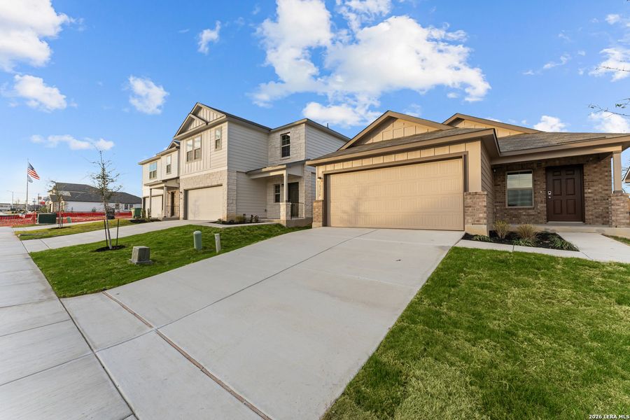 Front exterior of a new home in Paloma Park, Converse, TX, highlighting curb appeal (Image 2). Front exterior of a new home in Paloma Park, Converse, TX, highlighting curb appeal (Image 2).